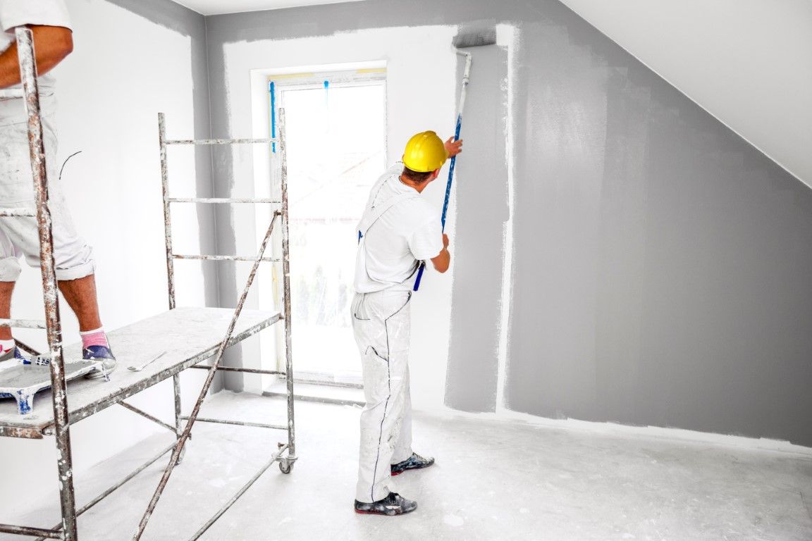 Painter preparing supplies for a house painting job in Albany, GA