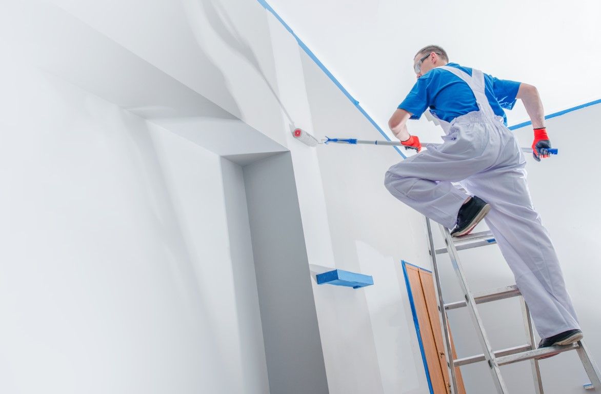 Painter rolling fresh color onto an interior wall in Albany, GA